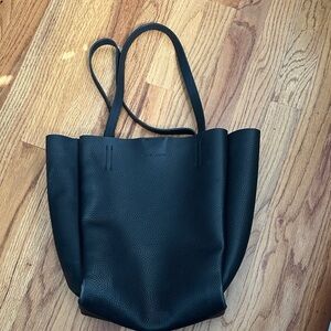 Vince Camuto Black Leather Tote Bag
Multi compartments and zip top